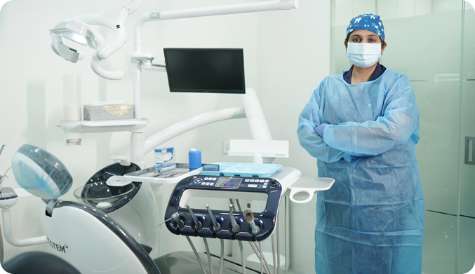 Dr Chaitali wearing mask and apron to maintain safety and hygiene for patient 